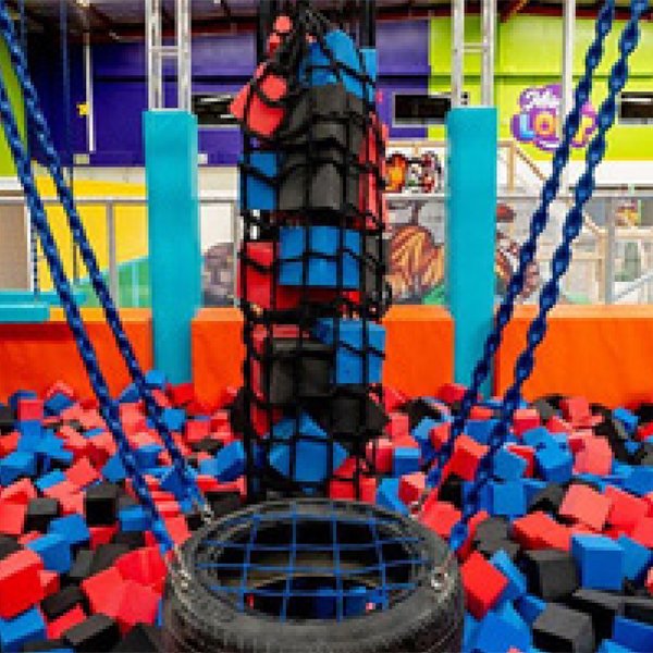 This is the free climbing area inside Indoor Ninja Parks. Ropes are used to secure the soft posts, and there's a net below, allowing children to practice ninja climbing techniques.